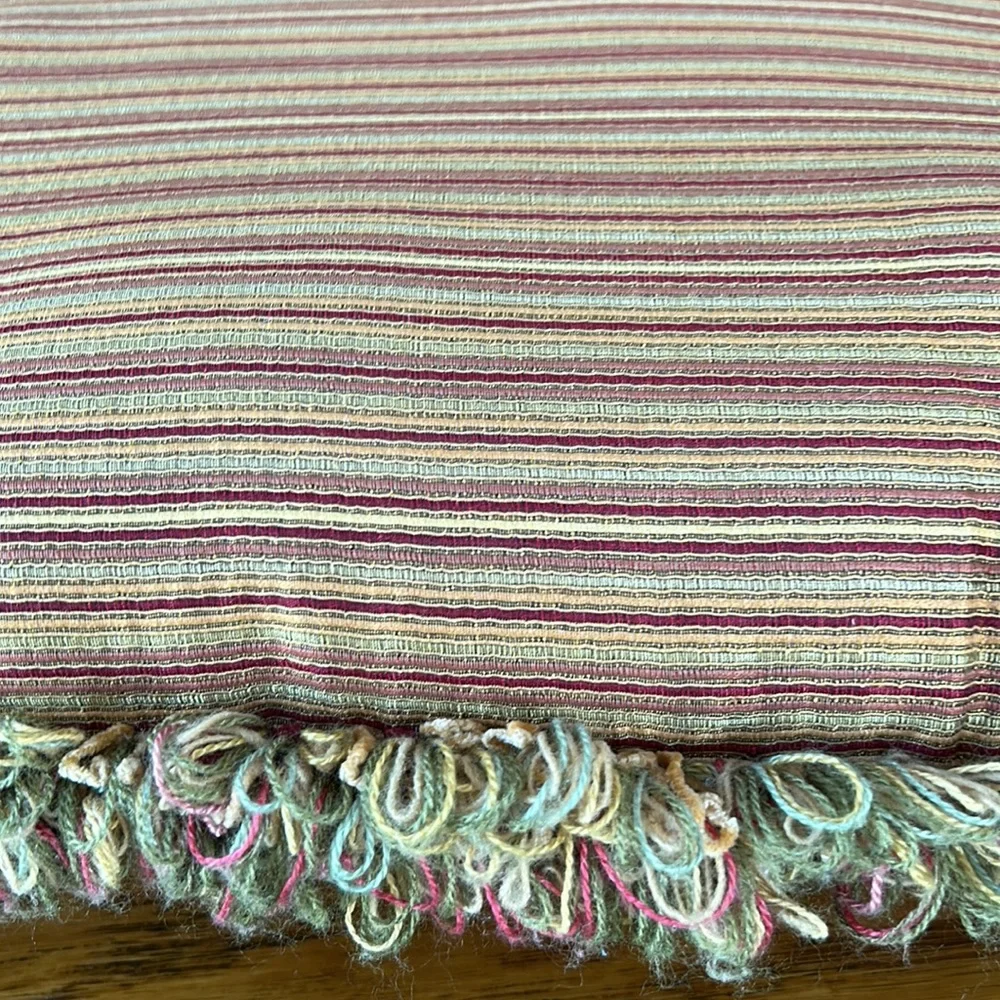 Striped gold/wine accent pillow with fringe.  Size is 14” x 18”